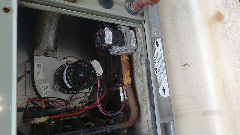 Responded to no-heat call at commercial building where temperature had dropped to 60°F. Upon inspection, found blower motor had failed, causing system to be unable to circulate heated air. Removed defective motor assembly and installed new replacement unit, reconnecting all wiring properly. After installation, tested system operation, verified proper heating function, and restored normal temperature to the building.