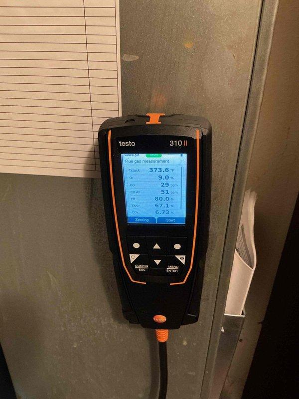Performed standard furnace tune-up on Lennox unit. Conducted comprehensive combustion analysis using Testo 310 II gas analyzer, confirming proper operation with readings showing 80.0% efficiency, 373.6°F flue temperature, and acceptable CO/CO2 levels within normal range. System is operating safely and efficiently.