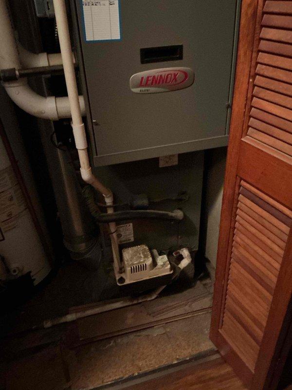 Performed scheduled maintenance on 27-year-old gas furnace. Inspected Lennox Elite HVAC system, checked connections, and verified proper operation. Adjacent Whirlpool water heater was noted but not serviced as part of this tune-up.