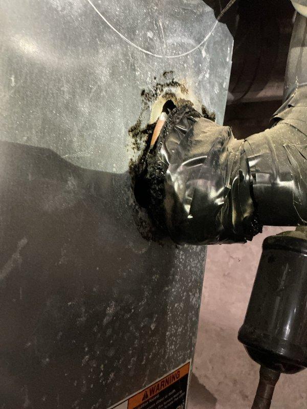 Performed routine maintenance on 4-year-old gas furnace. Identified and documented significant mold accumulation at the flexible duct connection point and inspected the condensate drain system with PVC piping and red valve. Recommended remediation for the mold issue to prevent potential air quality concerns.