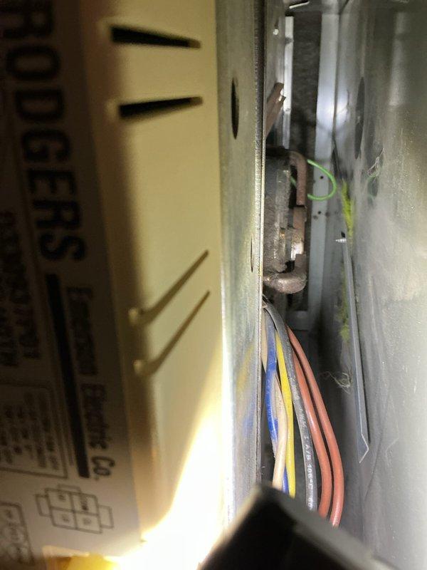 Performed annual furnace maintenance service, identifying significant mineral buildup and corrosion on the water shut-off valve connected to the copper supply line. Inspected internal electrical components and wiring connections (blue, yellow, red, green) within the control board housing, ensuring proper functionality of the system.