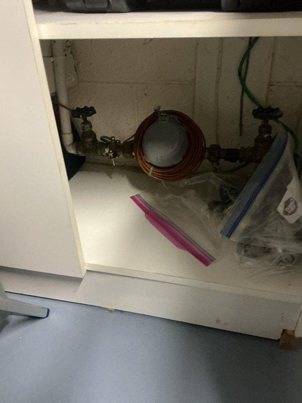 Conducted on-site assessment for water heater replacement at residential property. Inspected current unit (0 years old) and evaluated existing plumbing infrastructure including copper supply lines and shut-off valves. Documented HVAC proximity considerations and utility room configuration for proper installation planning. Customer referral through Veterans Service Commission.