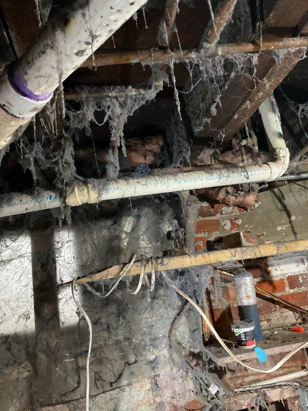 Conducted estimate for installation of new ductwork and replacement of severely deteriorated furnace system. Current unit shows significant age with exposed internal components and is located in a basement area with extensive cobweb accumulation, exposed brick walls, and poor maintenance conditions. Recommended complete system replacement and proper ductwork installation to improve heating efficiency and safety.