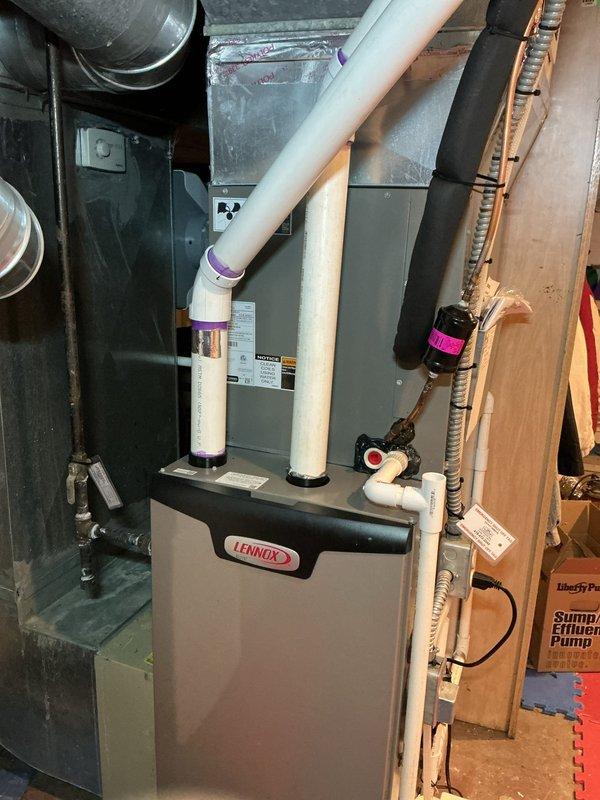 Performed furnace maintenance on Lennox natural gas unit. Inspected PVC intake/exhaust venting system and confirmed proper connections at all joints. Conducted video inspection of internal components and ductwork to verify system integrity.