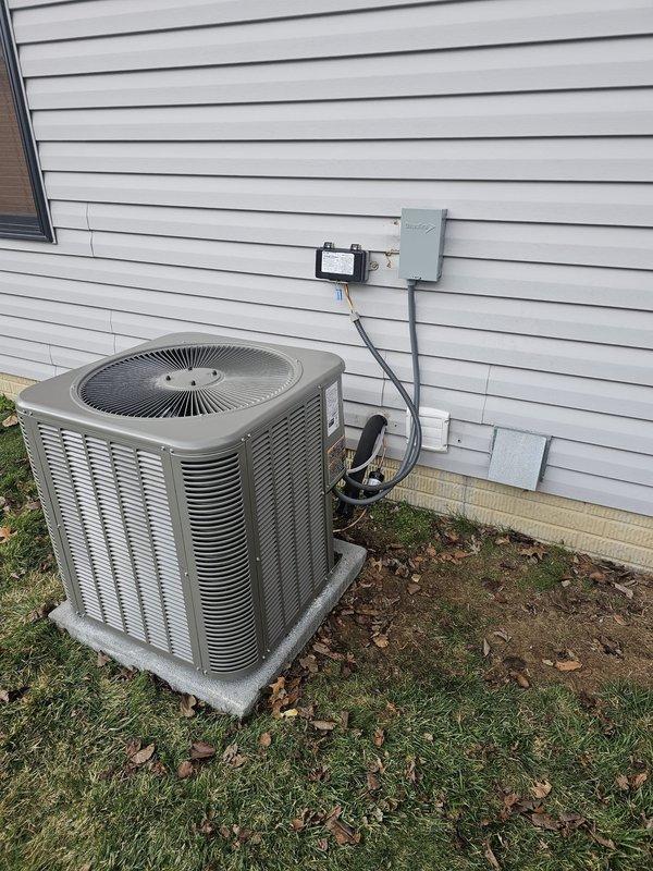 Completed installation of a 2-ton, 17 SEER 2-stage AC package with retrofit coil on EL296V furnace. Work included installing new 3/4" x 25' lineset, concrete equipment pad, electrical disconnect and whip, Honeywell WiFi thermostat, and 17-gallon humidifier. All connections were properly secured and system was tested for proper operation.