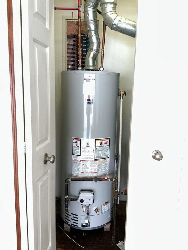 Responded to service call for non-operational tanked water heater in 1-year-old residential property. Upon inspection, found irregularly installed insulation around the tank and confirmed proper connection of ventilation ductwork and copper supply lines. Successfully diagnosed and restored water heater to full functionality, ensuring all connections were secure and the unit was operating according to manufacturer specifications.