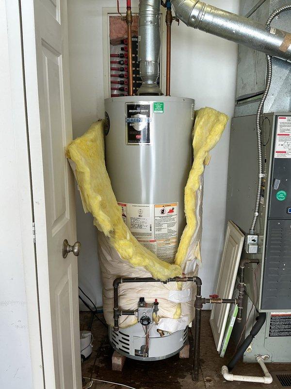 Responded to service call for non-operational tanked water heater in 1-year-old residential property. Upon inspection, found irregularly installed insulation around the tank and confirmed proper connection of ventilation ductwork and copper supply lines. Successfully diagnosed and restored water heater to full functionality, ensuring all connections were secure and the unit was operating according to manufacturer specifications.