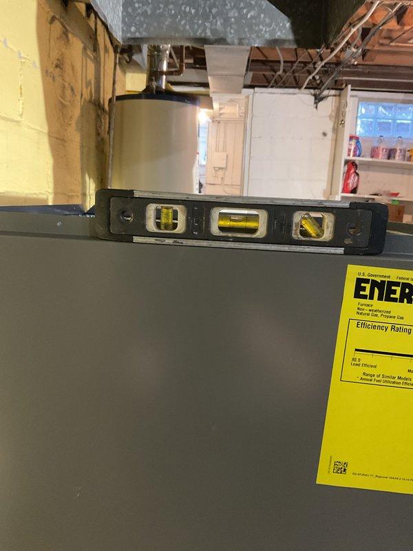 Successfully removed existing low boy furnace and installed new 80% efficient 70kbtu upflow furnace, requiring a 1/4 turn spin installation on 4" blocks. Completed necessary metalwork for supply and return drops and installed Honeywell T6 Pro thermostat, with all equipment properly leveled and vented according to specifications.
