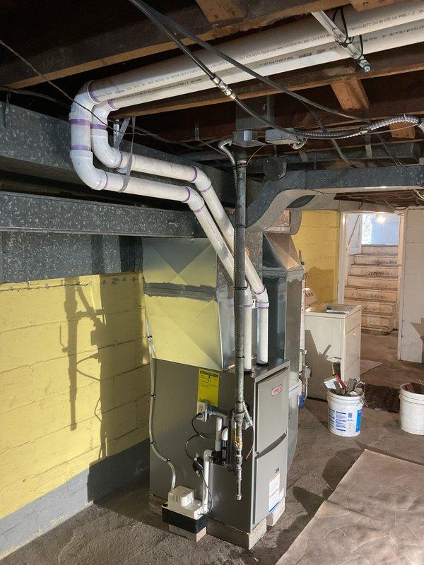 Successfully removed existing low boy furnace and installed new 80% efficient 70kbtu upflow furnace, requiring a 1/4 turn spin installation on 4" blocks. Completed necessary metalwork for supply and return drops and installed Honeywell T6 Pro thermostat, with all equipment properly leveled and vented according to specifications.