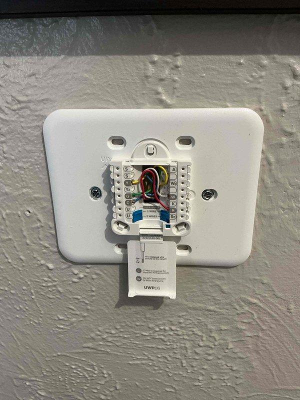 Responded to no-heat service call for a residential furnace. Diagnosed issue with thermostat wiring connections at terminal block. Properly reconnected and secured all control wires (R,W,G,Y,C), verified proper operation with the Honeywell digital thermostat, and confirmed system now maintaining set temperature of 70° with heat output functioning correctly.