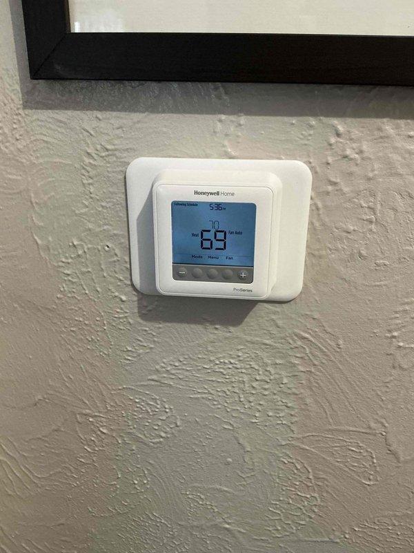Responded to no-heat service call for a residential furnace. Diagnosed issue with thermostat wiring connections at terminal block. Properly reconnected and secured all control wires (R,W,G,Y,C), verified proper operation with the Honeywell digital thermostat, and confirmed system now maintaining set temperature of 70° with heat output functioning correctly.