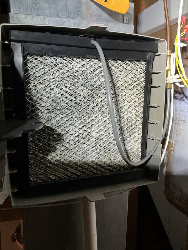 Performed scheduled furnace tune-up on Lennox unit. Verified proper equipment leveling using spirit level and inspected air filter, which showed normal particulate accumulation. System operating within specifications after service.