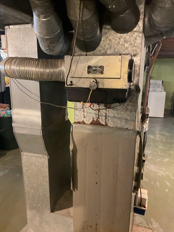 Conducted comprehensive estimate for full HVAC system replacement including humidifier installation. Current system shows significant age with visible rust, deterioration, and outdated components. Recommended complete replacement of existing furnace unit and associated ductwork to improve efficiency and reliability.