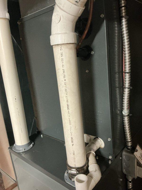 Completed routine maintenance service on 13-year-old gas furnace system. Inspected condensate drainage components and PVC piping, confirming proper installation and function. Examined air handler unit and associated control systems, verifying all components are in serviceable condition with no signs of deterioration.