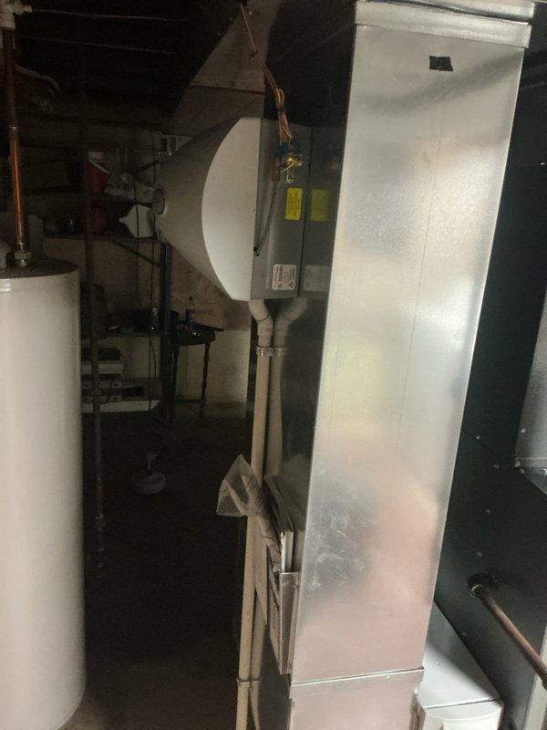 Completed routine maintenance service on 13-year-old gas furnace system. Inspected condensate drainage components and PVC piping, confirming proper installation and function. Examined air handler unit and associated control systems, verifying all components are in serviceable condition with no signs of deterioration.