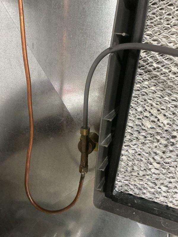 Responded to service call for a 7-year-old humidifier not functioning properly. Upon inspection, found mineral buildup on water supply components and corrosion on the valve assembly. Cleaned scale from distribution system, replaced the solenoid valve, and verified proper operation with the HVAC system.