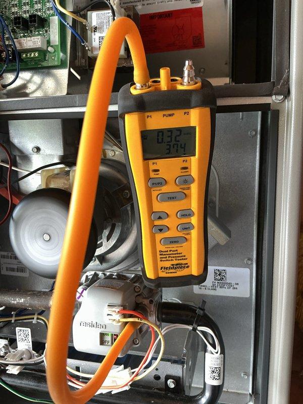 Performed scheduled MVP tune-up on heating system. Conducted pressure and temperature measurements using Fieldpiece diagnostic tool, with readings of 0.32 and 394 recorded. Inspected internal components, wiring connections, and safety systems to ensure optimal system performance.