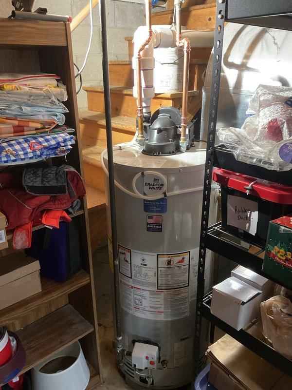# HVAC Install Call Back - Service Summary

Responded to warranty callback for installation correction inspection. Upon arrival, conducted comprehensive evaluation of recently installed water heater system and associated mechanical components per manufacturer specifications.

## Work Performed

Inspected Bradford White water heater installation and identified multiple deficiencies requiring correction. Addressed flue pipe installation concerns where improper sealing was causing potential exhaust leakage. Corrected flue connection to ensure proper venting and eliminate leak points in accordance with manufacturer requirements and code compliance.

Completed condensate drain line installation which was previously incomplete. Routed and secured condensate piping properly to ensure adequate drainage and prevent water damage. Verified proper pitch and termination point for condensate discharge.

Evaluated unit positioning and access clearances. Noted that current water heater orientation res