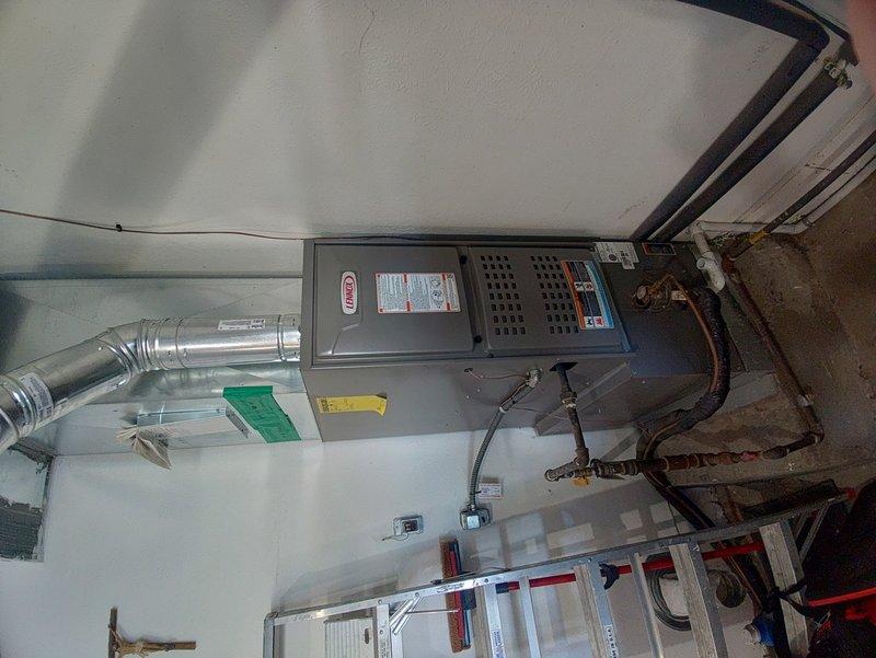 Responded to no heat call for furnace experiencing intermittent shutdowns. Upon arrival, inspected residential gas furnace unit and verified system was cycling off prematurely. Performed diagnostic evaluation of heating system including visual inspection of furnace components, ductwork connections, and gas line assembly. Documented equipment condition with photographs showing proper installation of HVAC unit with metallic supply ductwork, gas piping with safety shut-off valve, and standard utility room configuration. System restored to normal operation.