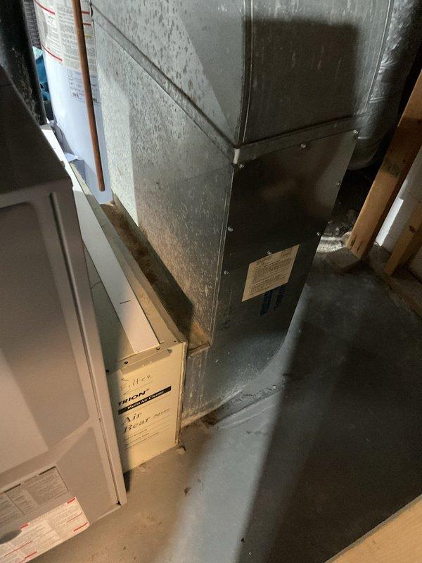 Completed comprehensive assessment of existing HVAC system for furnace replacement in residential basement utility area. Evaluated current beige furnace unit, associated ductwork including galvanized metal plenum and flexible insulated ducts, and all connected components including copper and black pipe gas lines with shutoff valves. Documented equipment specifications, installation configuration, and existing PVC venting system to provide accurate replacement estimate with appropriate sizing and compatibility requirements for new furnace installation.