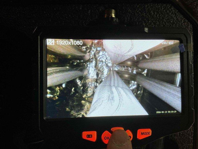 Completed standard HVAC tune-up service during scheduled maintenance visit. Performed visual inspection of ductwork system using borescope camera to assess interior condition, documenting findings with digital imaging. Inspection revealed metallic flex duct with visible residue accumulation and debris buildup on interior surfaces, which was noted for future maintenance considerations.