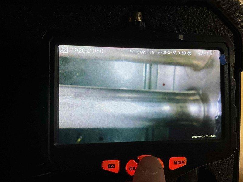 Completed standard HVAC tune-up service during scheduled maintenance visit. Performed visual inspection of ductwork system using borescope camera to assess interior condition, documenting findings with digital imaging. Inspection revealed metallic flex duct with visible residue accumulation and debris buildup on interior surfaces, which was noted for future maintenance considerations.