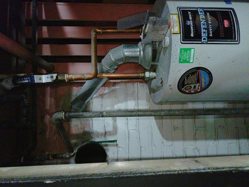 Responded to no-heat condition on residential tanked water heater. Upon arrival, confirmed unit was not producing hot water and pilot flame was extinguished. Inspected gas supply, thermocouple, pilot assembly, and gas control valve on aging water heater system. Identified failed thermocouple preventing pilot from remaining lit. Replaced thermocouple, re-lit pilot flame, and verified proper operation of main burner. Tested temperature and pressure relief valve for proper function and confirmed all connections were secure. Unit restored to full operational status with consistent hot water production.