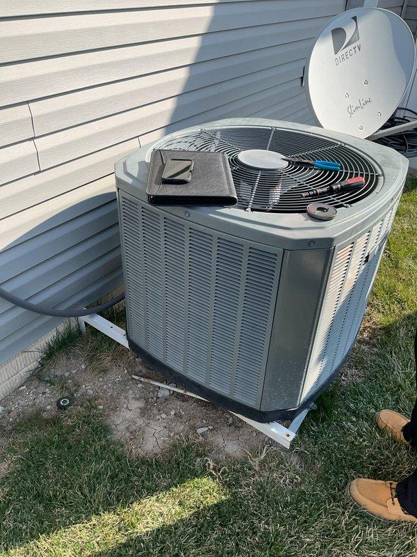 Completed comprehensive evaluation of existing residential HVAC system for full replacement estimate. Documented current equipment including basement-installed furnace unit with evaporator coil and outdoor cylindrical condenser unit. Assessed ductwork configuration, air filtration components, and condensate drainage system. Photographed all major equipment and installation conditions to provide accurate replacement specifications and system sizing recommendations.