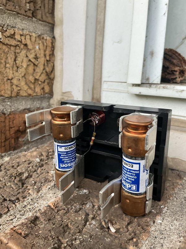 Performed AC system startup and verification following installation. Measured supply air temperature at 64°F using digital thermometer at air handler, confirmed proper cooling operation with visible condensation on evaporator coil indicating adequate refrigerant charge and heat exchange. Inspected and verified electrical disconnect box with fuses properly seated and secure, ensuring safe power supply to outdoor condensing unit.