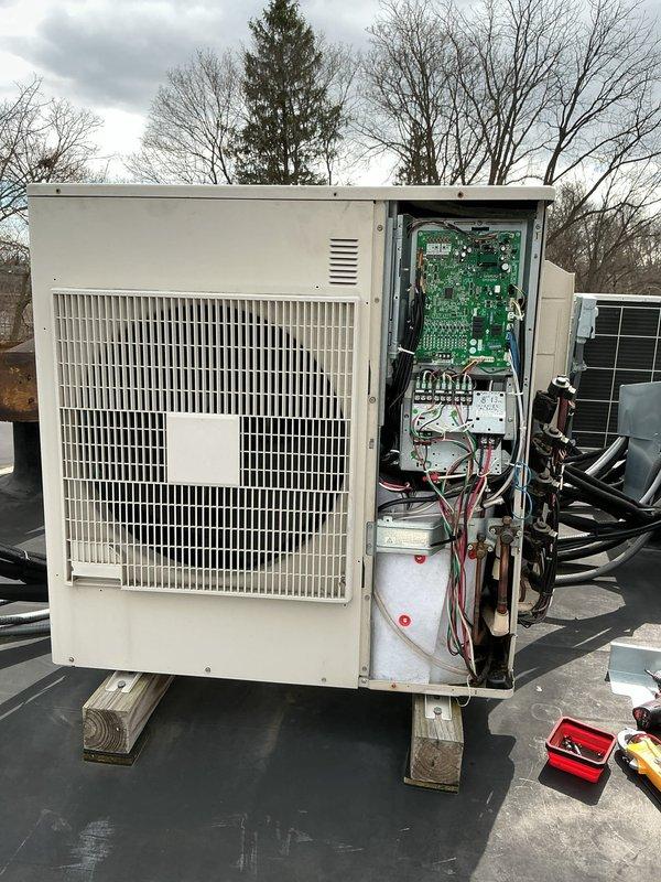 Responded to service call for 10-year-old mini split system not blowing or operating properly. Upon arrival, accessed outdoor condensing unit on rooftop and performed diagnostic inspection of internal components including control board, electrical connections, compressor, and refrigerant lines. Inspected green circuit board for signs of failure, verified wiring connections at terminal blocks, and examined copper refrigerant tubing and associated connections. Unit was evaluated for proper operation and necessary repairs identified to restore system functionality.