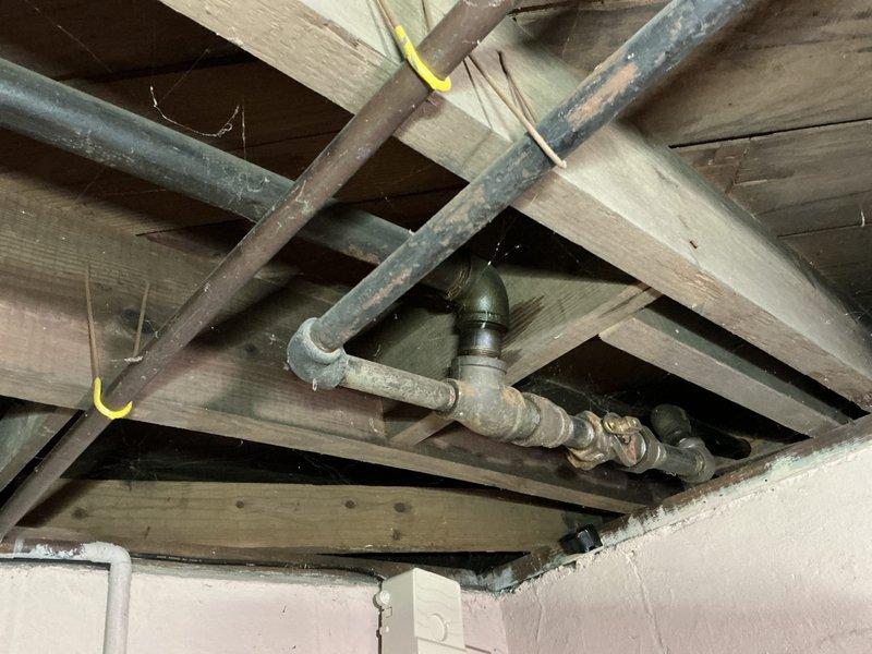 Responded to emergency call for non-operational furnace and water heater at commercial facility. Upon arrival, conducted thorough inspection of both systems with no error codes or indicator lights present on either unit. Assessed A.O. Smith ProMax water heater installation, examining gas control valve assembly, flue pipe connections, and water supply lines. Inspected attic space HVAC components including ductwork, piping infrastructure, and ventilation systems for potential issues affecting system operation. Documented equipment conditions and configurations through photographic records for service history. Systems evaluated for proper gas supply, electrical connections, and safety controls to identify root cause of simultaneous equipment failure.