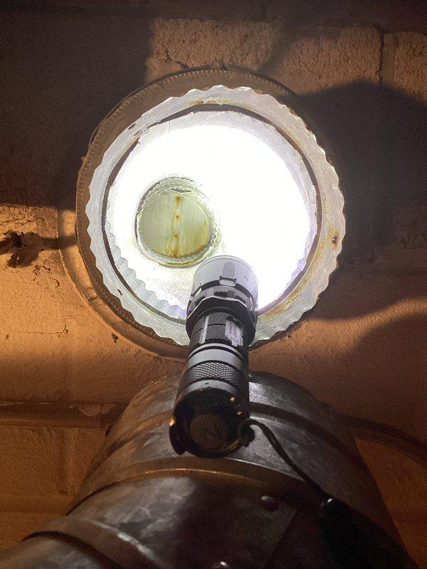 Responded to warranty callback for water intrusion issue affecting inducer motor on recently installed furnace system. Diagnosed that storm water was entering through exterior PVC vent termination, causing operational failures. Recommended and installed exterior vent cap/valve assembly on termination point to prevent water backflow into combustion air intake system, resolving moisture infiltration problem.