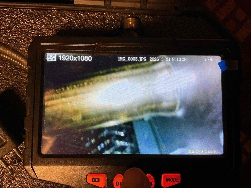 Completed MVP recurring cooling maintenance visit on residential HVAC system. Inspected air filtration system and documented pleated air filter showing moderate dust accumulation, indicating normal operation and particle capture. Performed internal system inspection using borescope camera to assess ductwork and mechanical components for proper condition and functionality.