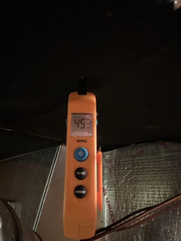 Completed startup and commissioning of new natural gas air conditioning system. Verified proper electrical protection with 25-amp time-delay fuses installed and secured in disconnect, and confirmed supply air temperature of 49.3°F at the ductwork, indicating system is cooling effectively and operating within normal parameters.