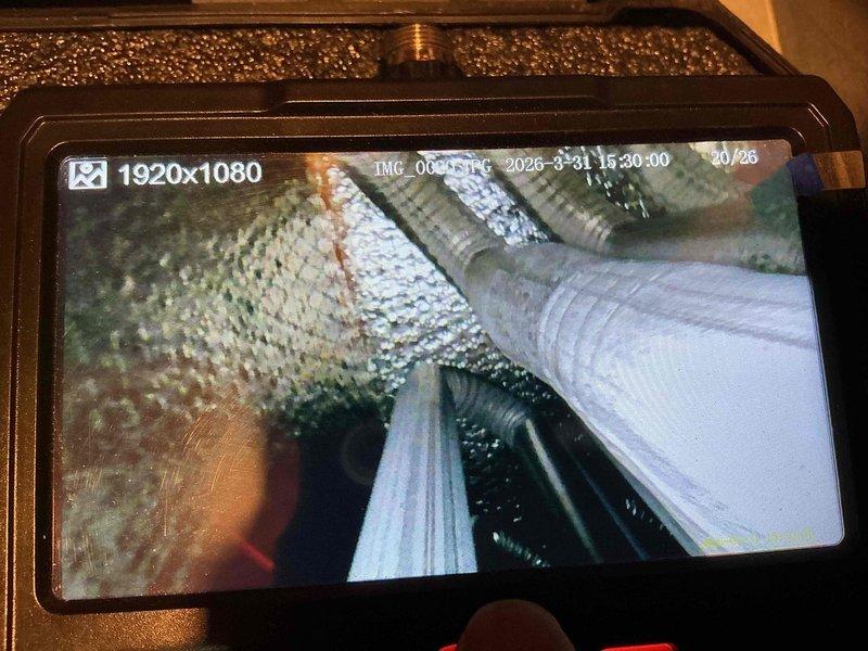 Completed routine maintenance on a 20+ year old air conditioning system. Performed comprehensive inspection using borescope camera to examine internal ductwork and components, verifying system integrity and identifying no immediate concerns. All mechanical components assessed and system confirmed operational for continued cooling service.