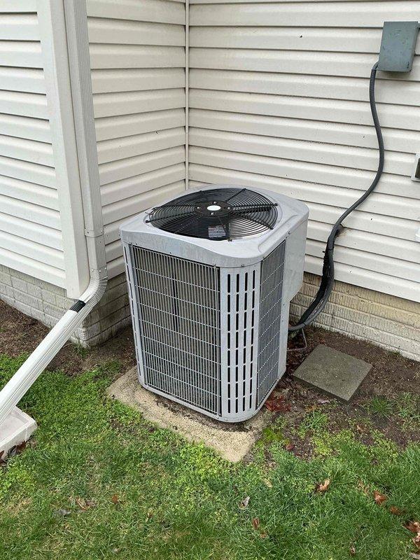 Performed routine AC maintenance on residential outdoor condenser unit. Completed visual inspection of unit exterior, verified proper operation of condenser fan, and confirmed unit is level on concrete pad with adequate clearance from structure. System operating within normal parameters.