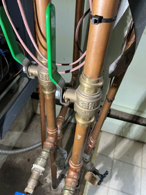 Responded to no-heat call on boiler system that had been previously serviced in January. Upon arrival, performed diagnostic inspection of the unit and associated piping infrastructure. Inspected copper supply and return lines, brass isolation valves, and low-voltage control wiring to identify cause of system failure. Photographed existing plumbing configuration showing proper pipe connections, valve arrangements, and wire management. Completed necessary repairs to restore heating operation. Tested system for proper function and verified heat delivery. Unit returned to normal operating condition.