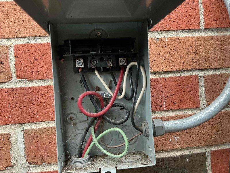 Performed comprehensive spring maintenance on Amana air conditioning system. Inspected and tested electrical disconnect box, verifying all wire connections and terminal integrity. Cleaned condenser coil, checked refrigerant lines and insulation, tested system operation and confirmed proper cooling performance. Unit operating within normal parameters with no issues identified.
