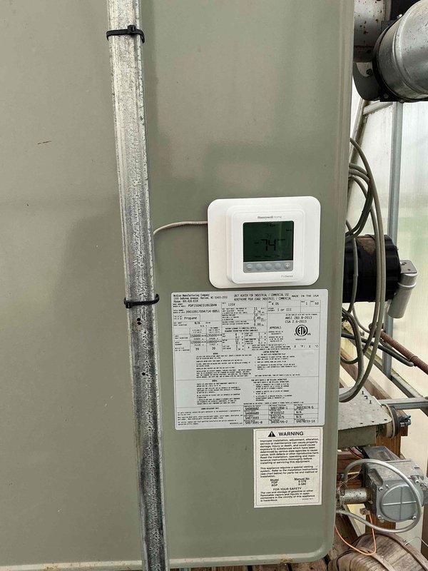 Responded to no-heat call on 12-year-old Hopkins furnace (Model PDP150AE0180SCAAN). Customer reported setting temperature up but receiving only cold air despite recent maintenance visit. Upon arrival, diagnosed faulty thermostat as cause of system malfunction. Per customer request, replaced existing thermostat with new Emerson digital unit from truck inventory. Verified proper wiring connections and system communication. Tested furnace operation through complete heating cycle, confirming unit now responds correctly to thermostat calls and delivers heated air at proper temperature. System operational and left in heating mode with customer satisfied.