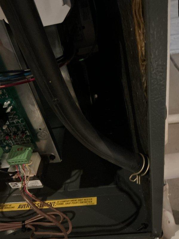 Completed scheduled maintenance tune-up on 12-year-old residential air conditioning system. Inspected control board, electrical connections, and refrigerant lines within the unit; all components found to be operating within normal parameters. Documented equipment condition with photographs of control panel and exterior condensing unit installation for service records.