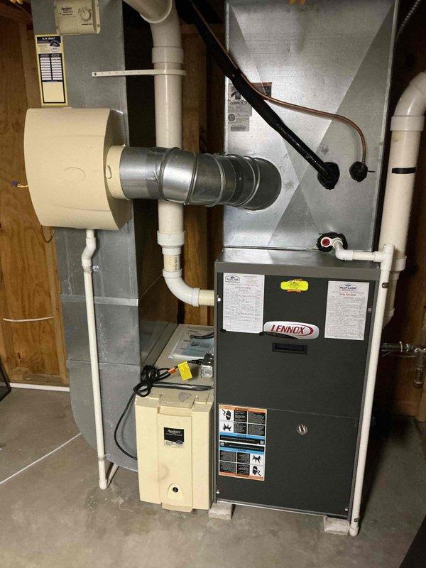 Completed comprehensive cooling maintenance on a 20-year-old Lennox HVAC system. Performed standard preventive maintenance procedures including inspection of refrigerant lines, cleaning of Aprilaire Model 5000 electronic air cleaner, and verification of all system components. All equipment found operational with humidifier and ductwork connections secure and functioning properly.