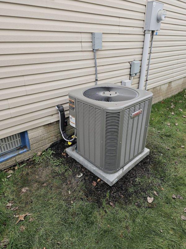 Completed installation of 14 SEER 2.5 ton single-stage air conditioning system with matching upflow cased coil to replace existing ductboard setup. Installed new 3/4" x 35' line set, positioned condenser unit on new concrete pad placed 3 feet from electrical meter per specifications, and connected electrical disconnect with whip. Programmed and mounted Honeywell T6 Pro thermostat to complete system setup and verified proper operation of all components.