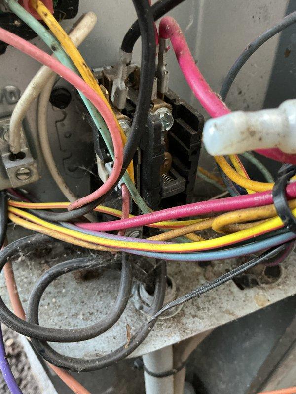 Completed scheduled maintenance on a 12+ year old air conditioning system. Performed standard tune-up procedures including inspection of electrical connections, which showed signs of age-related corrosion at the terminal block, and evaluated overall system components in the basement utility area. All routine maintenance tasks were completed as requested.
