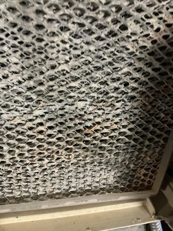 Completed comprehensive heating system tune-up and maintenance service. Inspected HVAC system components, including air handler unit and filtration system. Identified significant dust accumulation on return air grille mesh screen, indicating reduced airflow efficiency. Removed and replaced dirty pleated air filters with new units to restore proper system airflow and improve indoor air quality. Verified all mechanical components operating within normal parameters upon completion of maintenance procedures.