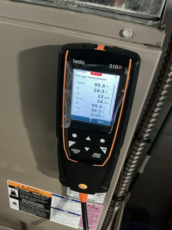 Completed comprehensive heating tune-up on 4-year-old furnace, performing combustion analysis with Testo 310 II flue gas analyzer which confirmed safe operation with CO reading of 12 ppm, oxygen level at 10.3%, and efficiency at 99.4%. Inspected all system components including PVC condensate drain lines and venting, verified proper connections and drainage, and ensured all safety labels and warnings were visible and intact.