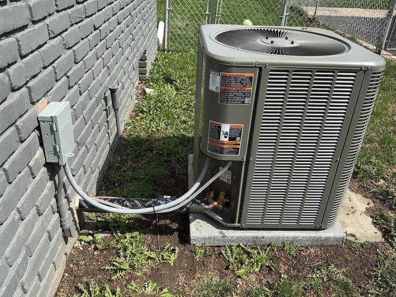Completed AC system startup on dual outdoor condensing units installed on concrete pads in residential backyard. Performed comprehensive system commissioning including electrical verification, refrigerant charge confirmation, airflow testing, and operational checks on both units to ensure proper performance and efficiency. All systems tested successfully and left in normal operating condition.