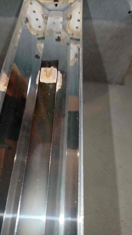 Responded to no heat call where customer reported burning plastic smell from furnace the previous night. Upon inspection, discovered severely corroded heat exchanger with visible deterioration and surface oxidation. Used borescope camera to document internal damage to heat exchanger cells, confirming multiple areas of concern that posed potential safety hazard. Removed and photographed damaged heat exchanger section showing significant corrosion on copper-colored metal surfaces. Recommended furnace replacement due to failed heat exchanger and age of unit. System tagged out of service for safety until replacement can be completed.
