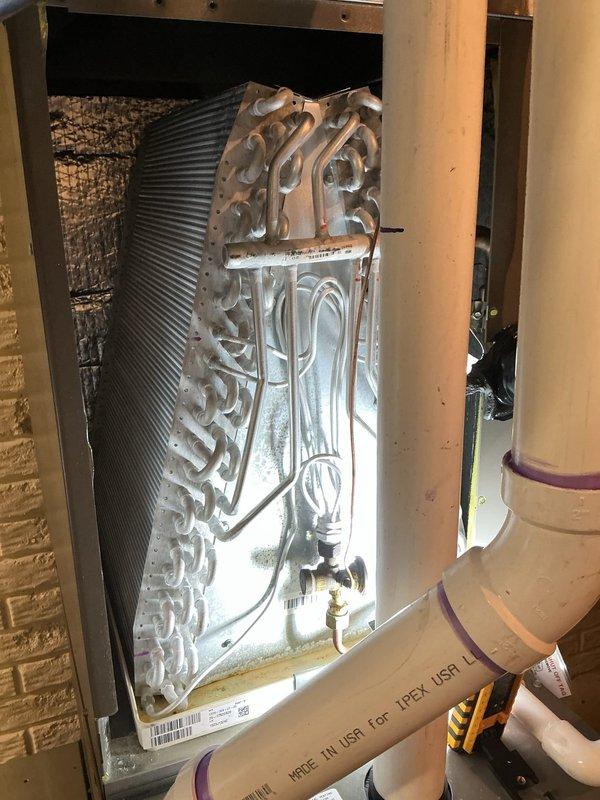 Completed recurring cooling service maintenance visit on residential HVAC system. Performed thorough inspection of evaporator coil assembly within air handler unit, verified proper installation and mounting within cabinet, and documented system condition through photographic record. All components including refrigerant lines, drainage piping, and electrical connections found to be properly secured and functioning as designed.