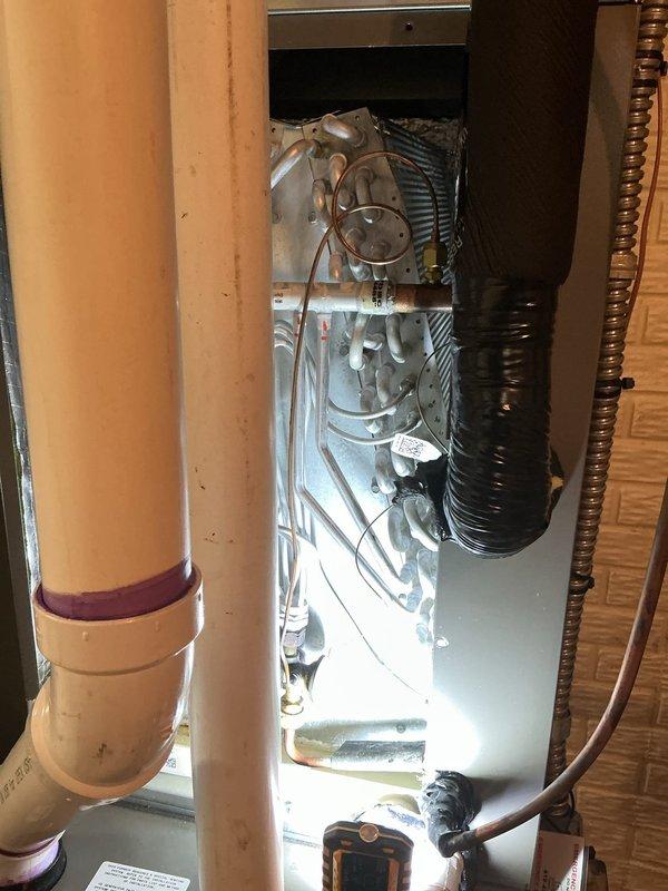 Completed recurring cooling service maintenance visit on residential HVAC system. Performed thorough inspection of evaporator coil assembly within air handler unit, verified proper installation and mounting within cabinet, and documented system condition through photographic record. All components including refrigerant lines, drainage piping, and electrical connections found to be properly secured and functioning as designed.
