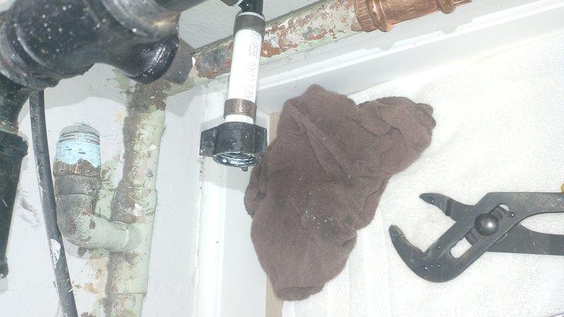 Responded to callback for leaking exterior hose bibb that was triggering water alarm system hourly. Upon inspection, discovered the outdoor spigot installation had failed due to severely corroded supply piping. Removed deteriorated metal pipes showing extensive mineral buildup and oxidation. Replaced compromised section with new copper piping and properly secured connections with shutoff valve. Tested system for leaks and verified alarm system reset. Installation now functioning properly without water intrusion.